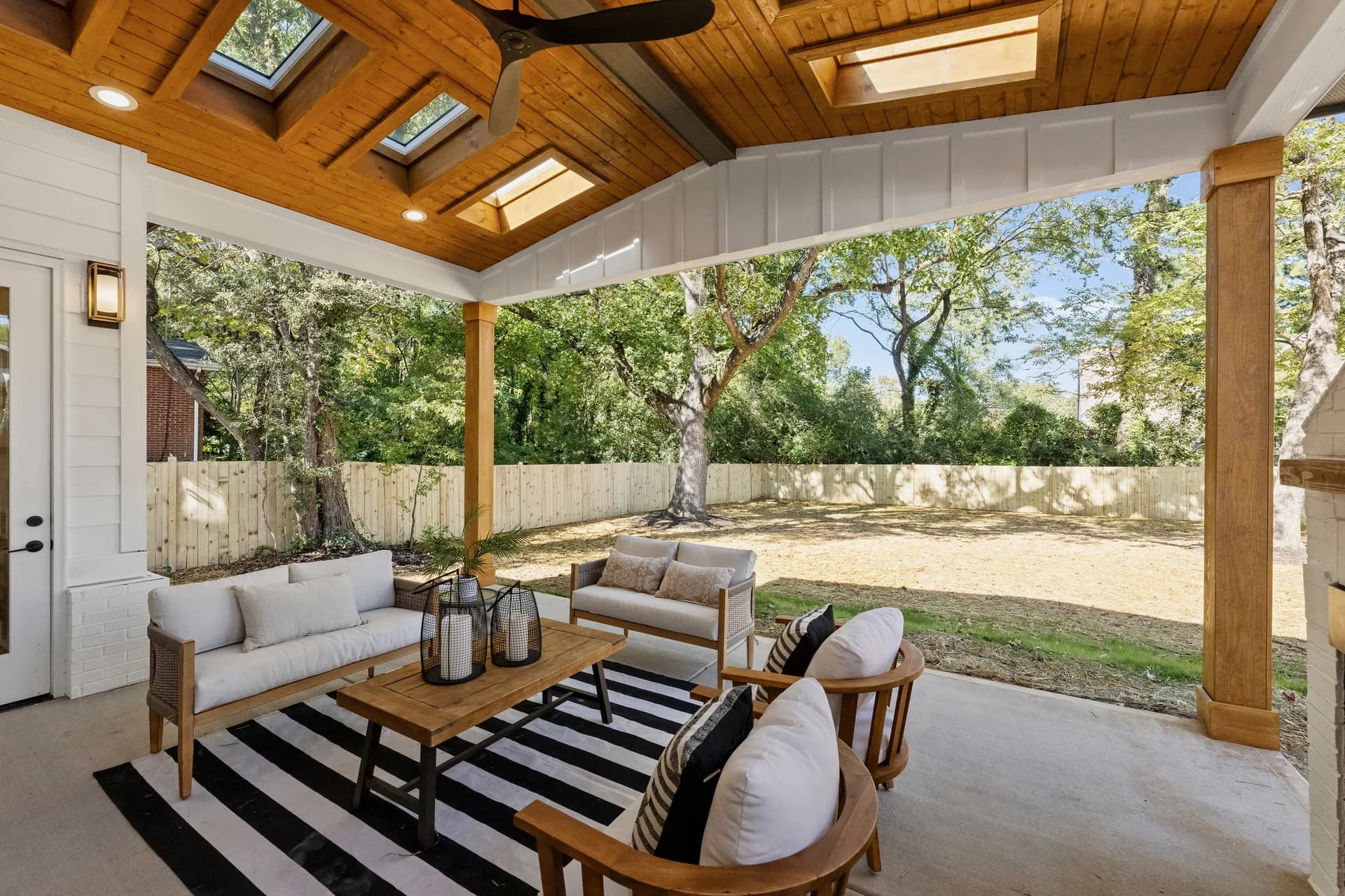 Completed timber posts, beams, and roof connections on the covered patio at 563 Lyttleton Dr.